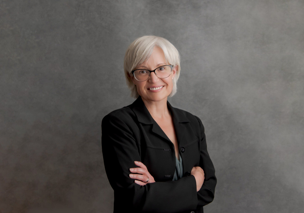 Professional headshot woman wearing black suit Lansdale