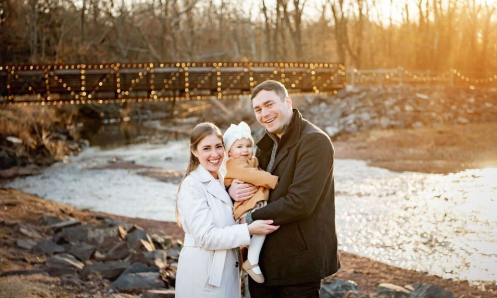 Mom Dad and baby smiling