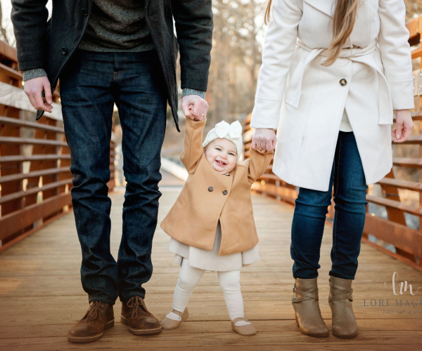 A couple with their baby girl on the bridge Fischers Park Lansdale