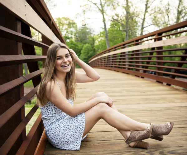 High School Senior sitting on the bridge at Fischers Park in Lansdale Lansdale family and newborn photographer