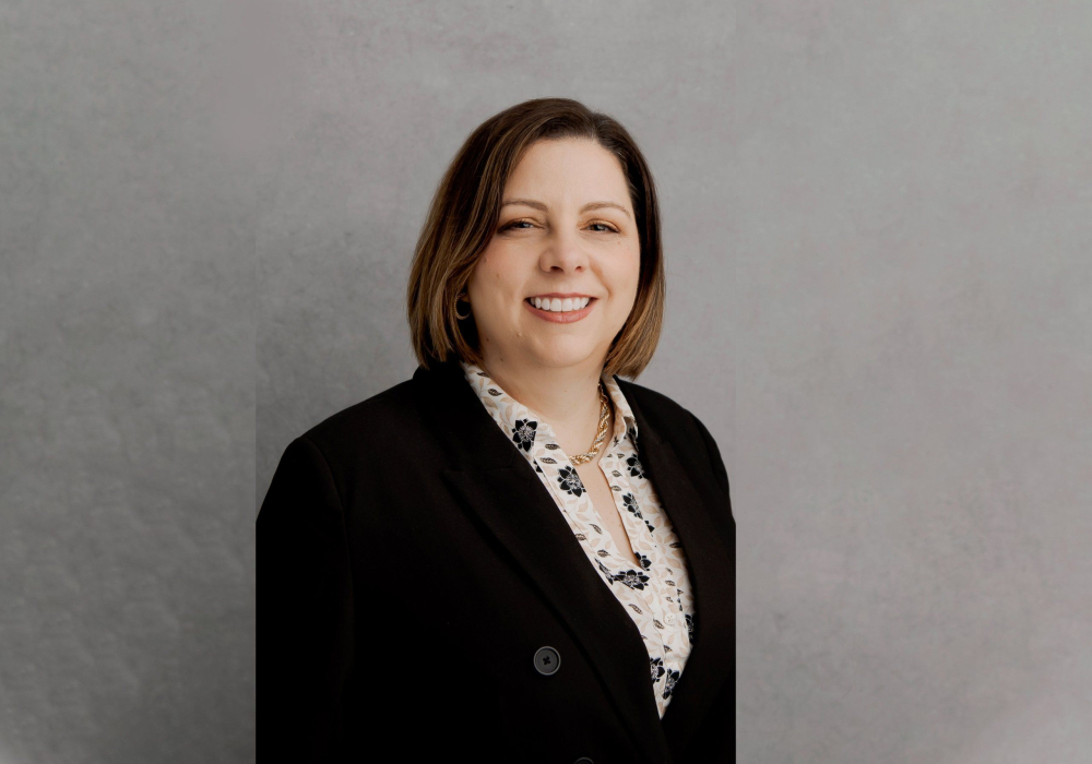 Professsional headshot woman wearing black suit jacket Lansdale