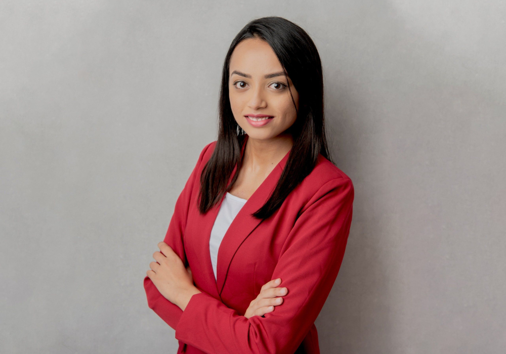 Professional headshot woman wearing red jacket with white blouse Lansdale