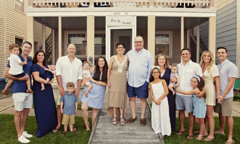family standing in front of the house in ocean city new jersey