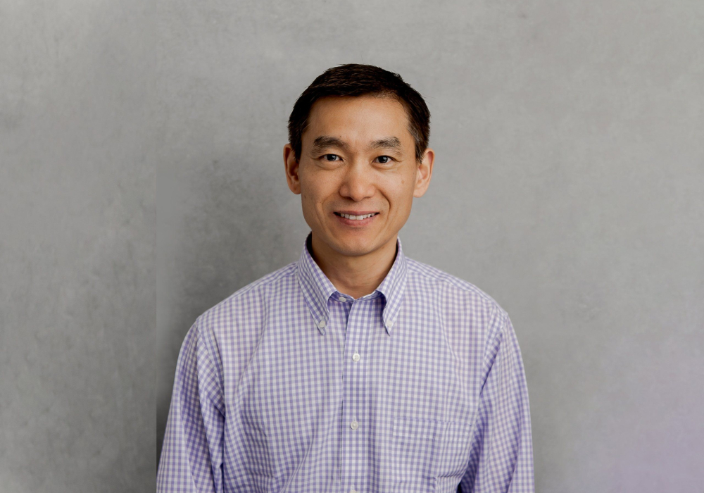 Professional headshot man wearing purple and white button up dress shirt Lansdale