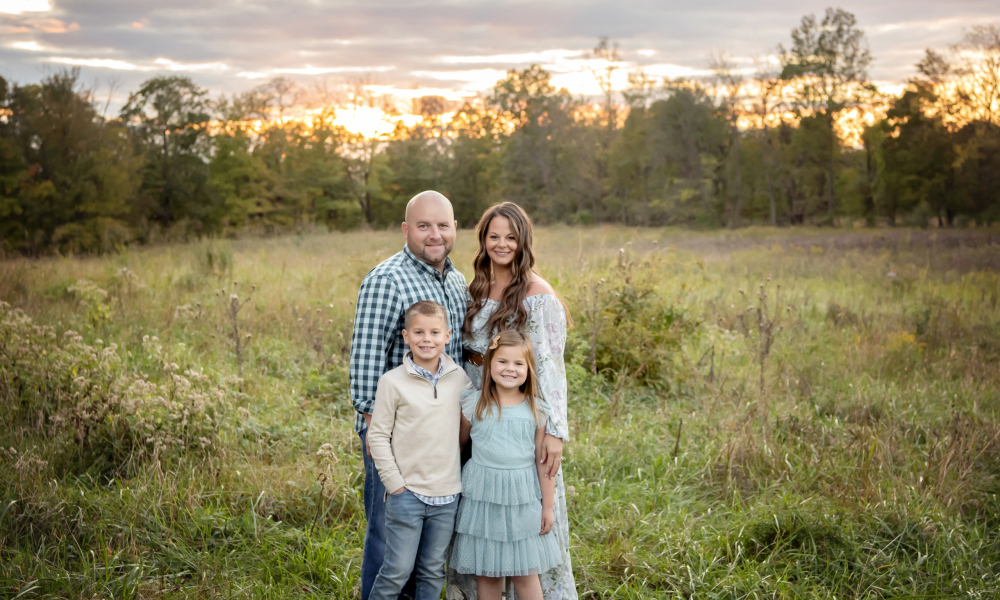 A bald man with his family