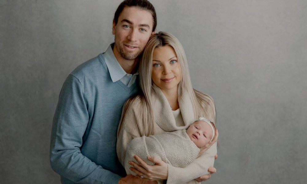 Mom and Dad holding newborn baby girl - Lansdale Family and Newborn Photographer