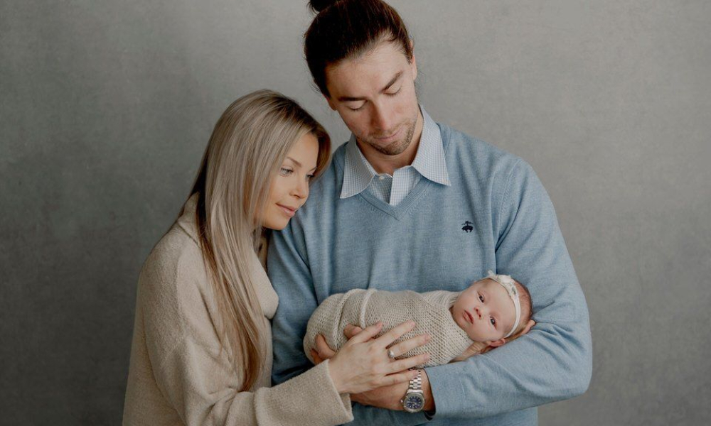 Dad holding a in lap newborn baby